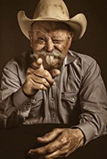 Actor Barry Corbin in a cowboy hat pointing at the camera 2022